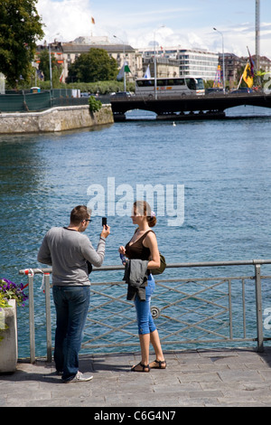 Geneva Promenade -- man taking photo of woman