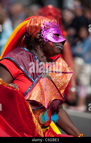 Female dancer wearing a colourful costume at the Notting Hill Carnival, London , England, UK. Stock Photo