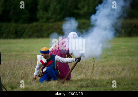 Display of medieval firearms and cannons by the Compagnie of Seint Barbara at the medieval festival held at Herstmonceux castle Stock Photo