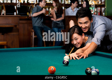 Couple Playing Pool Together Stock Photo