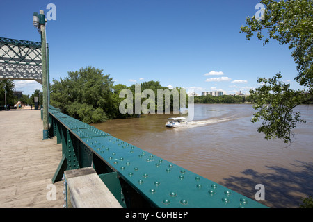 the forks junction of the red and assiniboine rivers viewed from the historic rail bridge Winnipeg Manitoba Canada Stock Photo