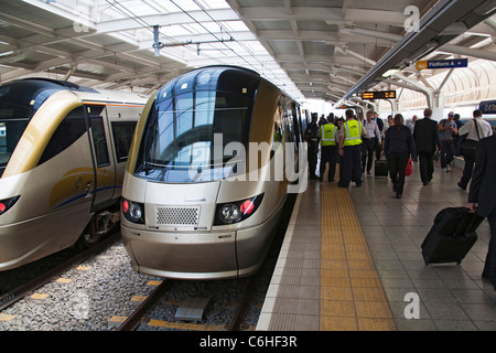 Commuters disembarking from the Gautrain at OR Tambo airport station Stock Photo