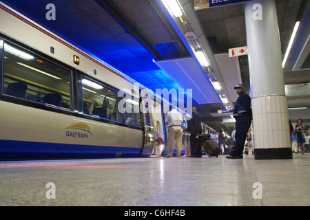 Commuters preparing to climb on board the Gautrain Stock Photo