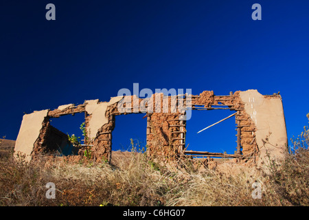 A derelict house made from a traditional wood and mud building materials Stock Photo