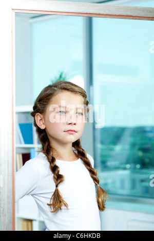 Portrait of cute child posing in front of camera Stock Photo