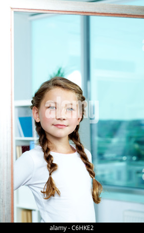 Portrait of cute child posing in front of camera Stock Photo