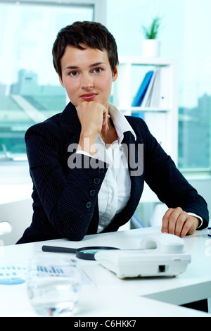 Photo of smart businesswoman looking at camera Stock Photo