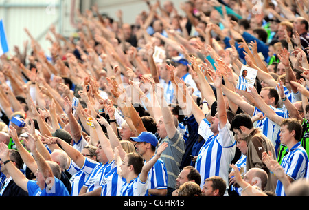 Brighton and Hove Albion football fans cheer on their team during a match at American Express Community Stadium aka The Amex Stock Photo