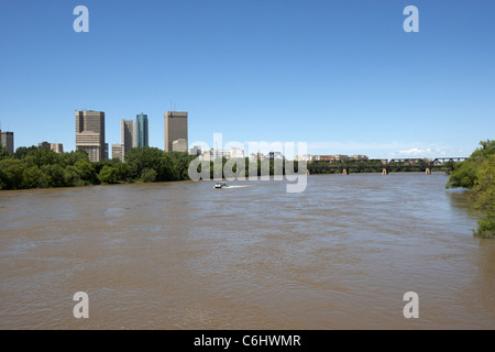 the red river in flood through central downtown winnipeg manitoba canada Stock Photo