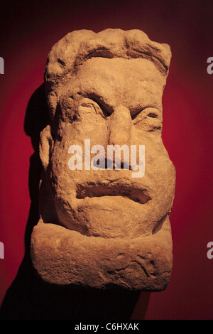 A Theatrical Mask stone sculpture in the museum, The Roman Baths, Bath, Somerset, England. Stock Photo