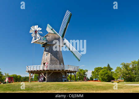 A windmill used for grinding grain into flour at the Mennonite Heritage Village in Steinbach, Manitoba, Canada. Stock Photo