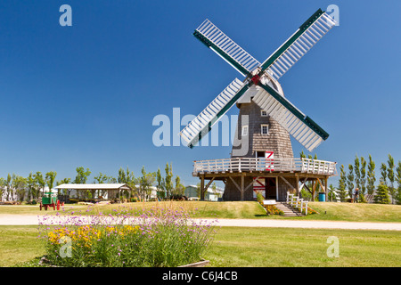 A windmill used for grinding grain into flour at the Mennonite Heritage Village in Steinbach, Manitoba, Canada. Stock Photo