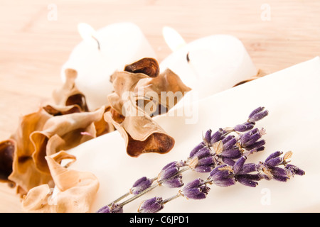 spa composition with bar of natural soap, candles, lavender and potpourri Stock Photo