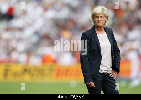 Germany National Team head coach Silvia Neid watches team warmups prior to the opening match of the 2011 Women's World Cup. Stock Photo