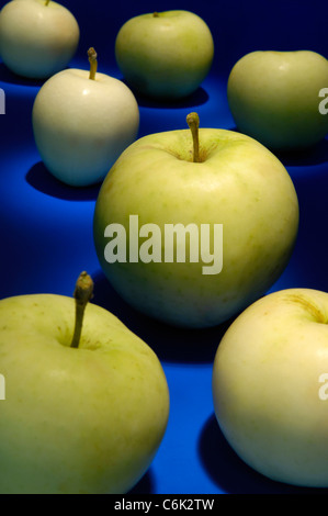 Green apples on blue background abstract pattern Stock Photo