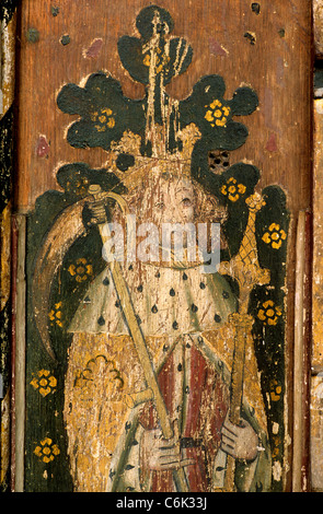 Sparham, Norfolk. Rood screen, St. Walstan of Bawburgh, with crown, sceptre and scythe, the Agricultural Saint,  screens Stock Photo