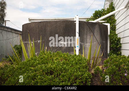Exterior of a domestic water storage tank and Aqua measure, measuring water level inside the tank. Northland, New Zealand. Stock Photo