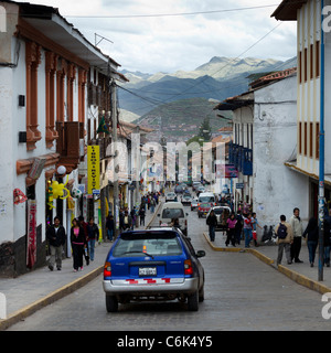 Cars and people on a narrow street, Sacred Valley, Cusco Region, Peru Stock Photo