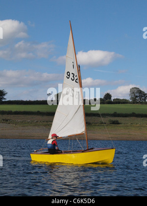 Young boy sailing a Heron Dinghy. Wimbleball Lake 