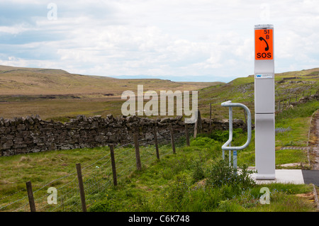 An emergency telephone beside the A66 road crossing the North Pennines. Stock Photo