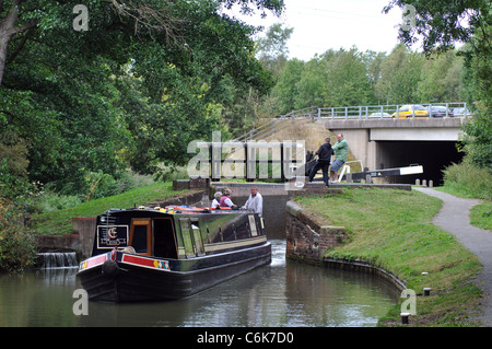 Narrowboat on the Stratford Canal with the M40 motorway behind, Warwickshire, UK Stock Photo