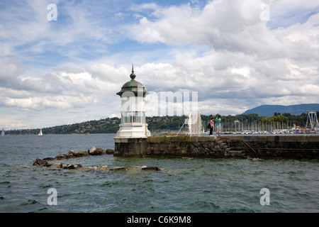 Lighthouse beacon on Pier on Lake Geneva Stock Photo