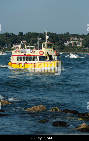 Yellow ferry boats from Poole Harbour to Brownsea Island in Dorset. Stock Photo