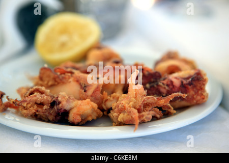 Plate of deep fried octopus in a Greek restaurant Stock Photo