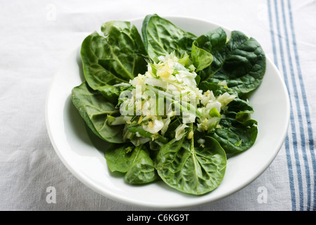 Fresh spinach with chopped onions and ginger Stock Photo