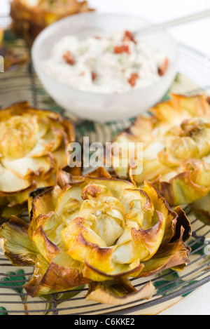 Fried artichokes with ricotta and sundried tomato dip Stock Photo