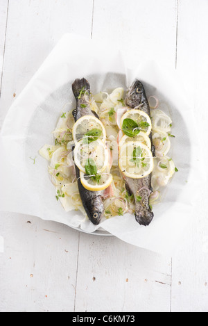 Baked trout with lemon, fennel and basil Stock Photo