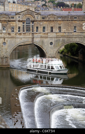 Taking a boat trip on the Sir William Pulteney along the river Avon passing under the arches of the Pulteney bridge in Bath, Somerset UK in August Stock Photo