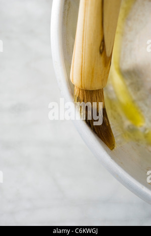 Greasing baking pan Stock Photo - Alamy
