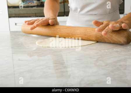 Rolling out pastry dough Stock Photo