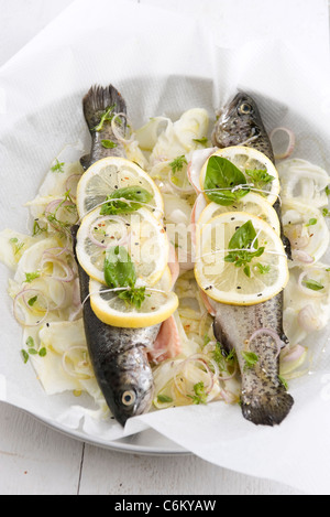 Baked trout with lemon, fennel and basil Stock Photo