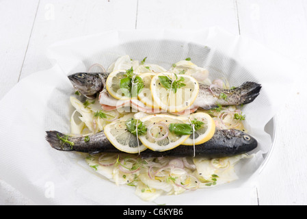 Baked trout with lemon, fennel and basil Stock Photo