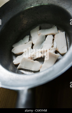 Raw bacon in pan Stock Photo