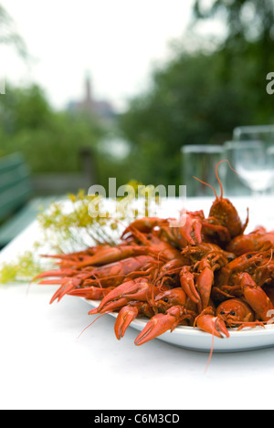 Boiled crawfish on outdoor dinner table Stock Photo