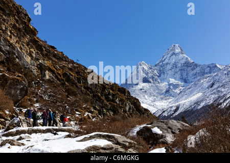Trekkers and Ama Dablam mountain, Everest Region, Nepal Stock Photo