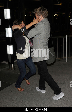 Frankie Sandford from girl group The Saturdays, and Tom Fletcher from boy band McFly arriving at Heathrow airport, having Stock Photo