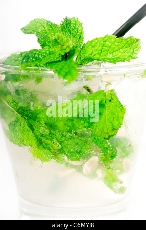 mojito caipirina cocktail with fresh mint leaves ,yerba-buena, with lime and black straw isolated on white background Stock Photo