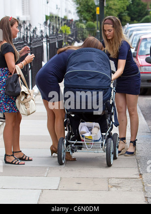 Carly Zucker aka Carly Cole The wife of Chelsea football player Joe Cole, out with friends and baby daughter, Ruby Tatiana, in Stock Photo