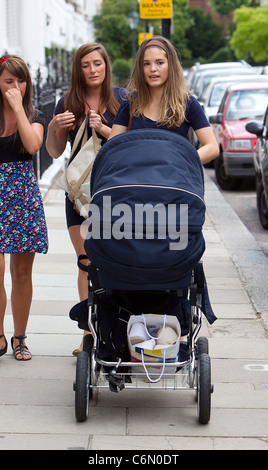 Carly Zucker aka Carly Cole The wife of Chelsea football player Joe Cole, out with friends and baby daughter, Ruby Tatiana, in Stock Photo