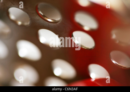 Close up of holes in a grater Stock Photo