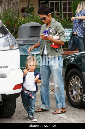 Actress Halle Berry dresses her daughter Nahla in an identical outfit to her own for a day of fun at the park. The X-Men star Stock Photo