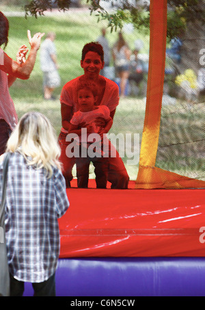 Actress Halle Berry dresses her daughter Nahla in an identical outfit to her own for a day of fun at the park. The X-Men star Stock Photo