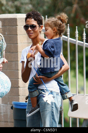 Actress Halle Berry dresses her daughter Nahla in an identical outfit to her own for a day of fun at the park. The X-Men star Stock Photo