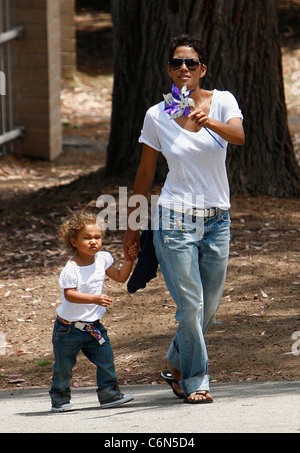 Actress Halle Berry dresses her daughter Nahla in an identical outfit to her own for a day of fun at the park. The X-Men star Stock Photo