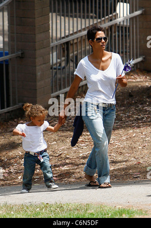 Actress Halle Berry dresses her daughter Nahla in an identical outfit to her own for a day of fun at the park. The X-Men star Stock Photo