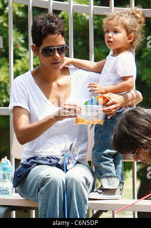 Actress Halle Berry dresses her daughter Nahla in an identical outfit to her own for a day of fun at the park. The X-Men star Stock Photo